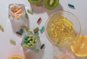 vitamins and orange slices on the counter