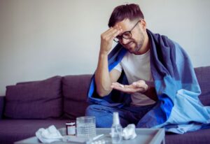man who is sick with a head cold